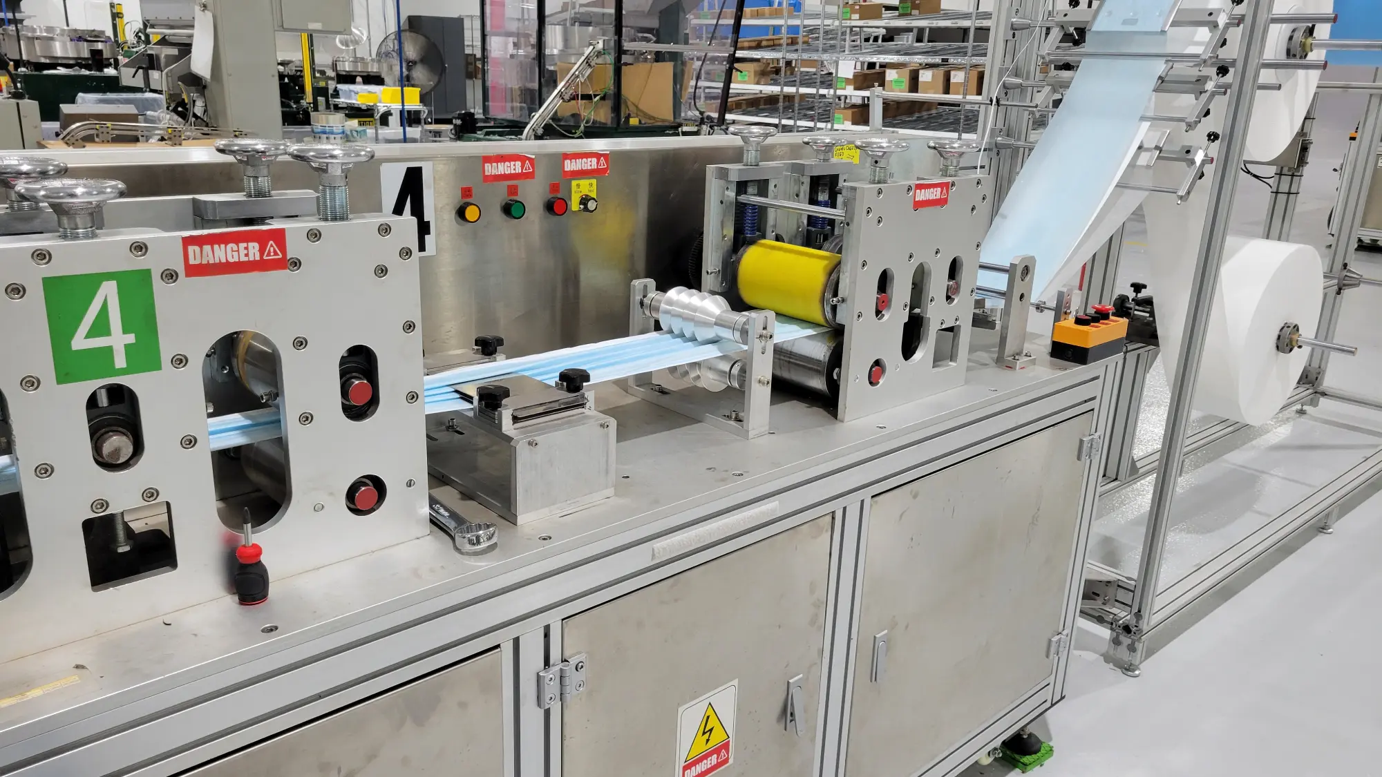 A picture of a machine that makes PPE face masks.