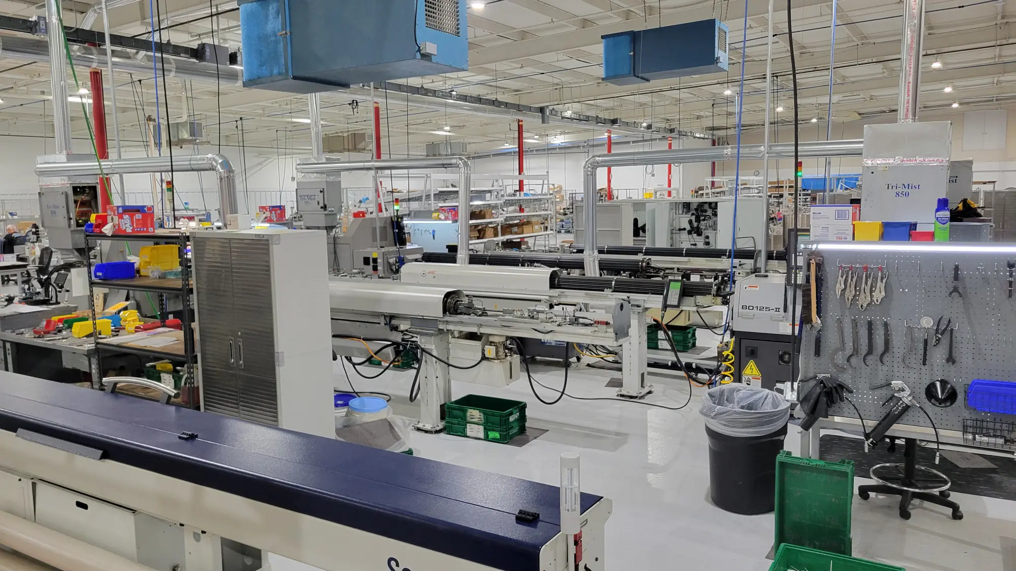 An image of a shop with several Tsugami Swiss-Type CNC machines.