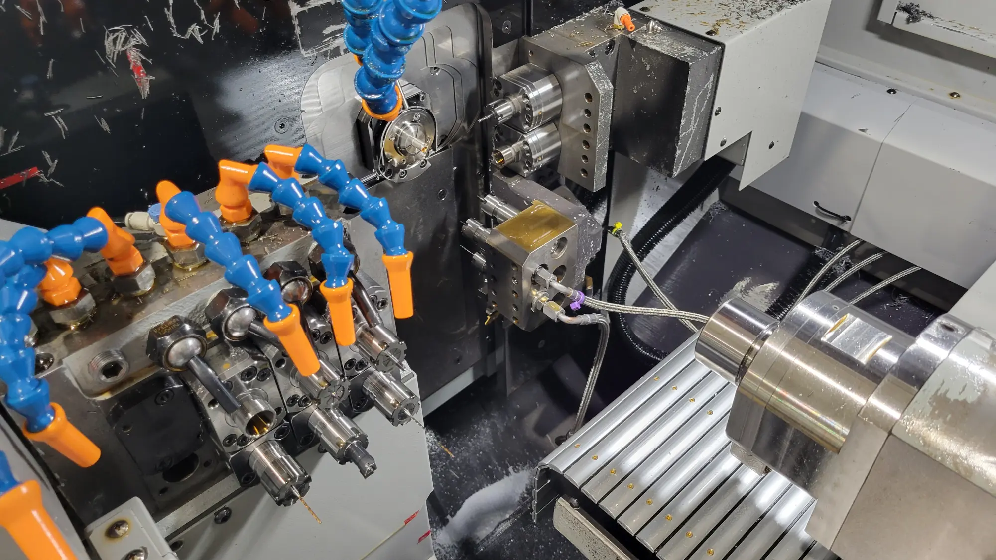 A picture of the inside of a Tsugami Swiss-Type CNC machine.