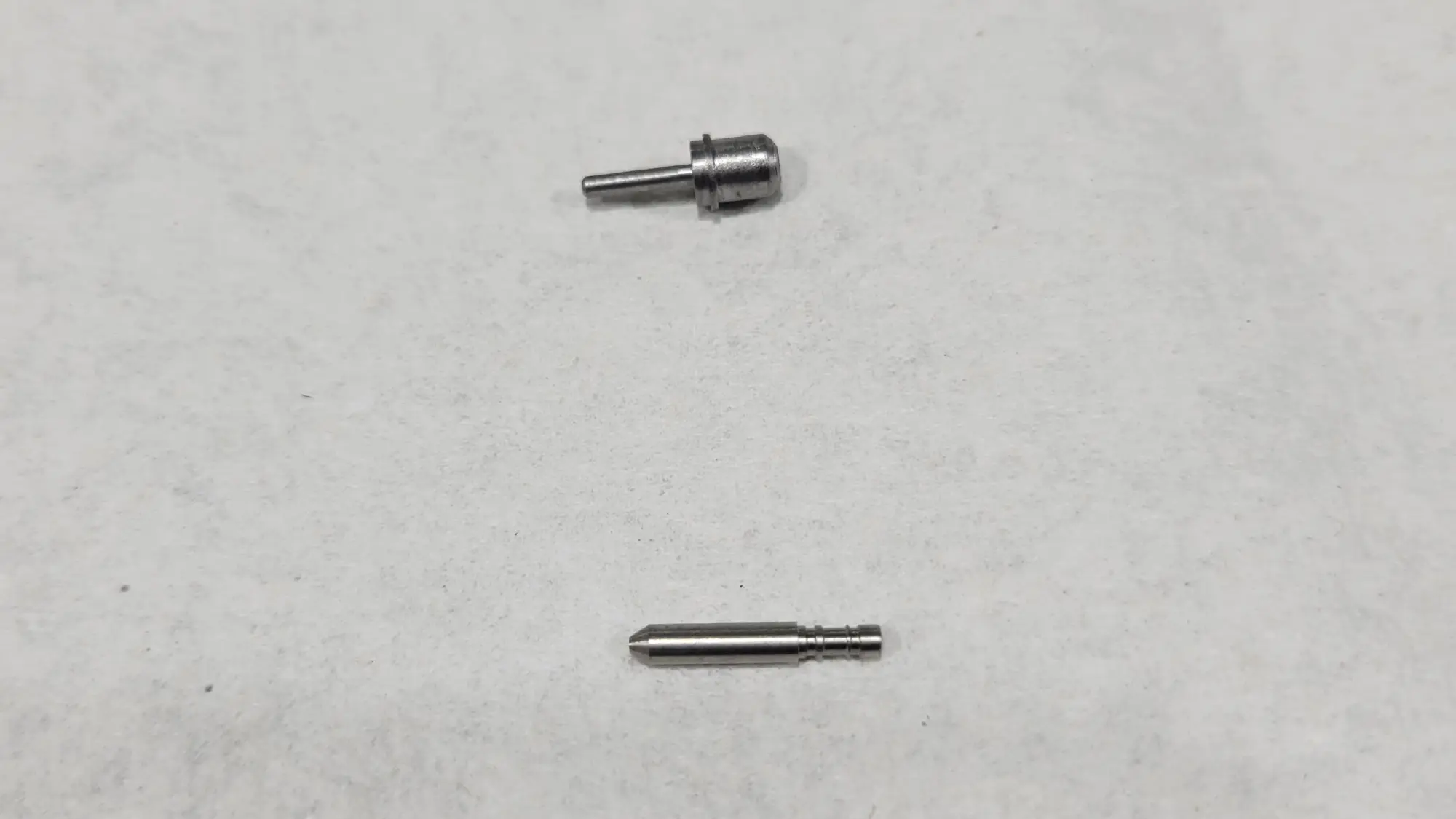 A picture of two different types of custom fiber optic ferrules